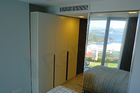 Image of a stylish and modernly furnished bedroom in a luxury villa for sale in Bodrum.