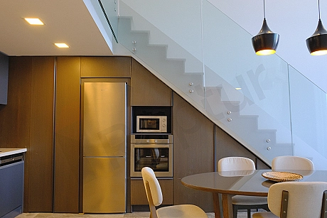Elegant and spacious dining room area decorated with modern furniture.