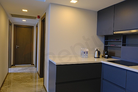 Spacious and stylish interior corridor view of a luxury villa with modern architecture.