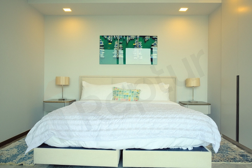 Modern and stylishly decorated, spacious and bright bedroom interior design in a luxury villa.