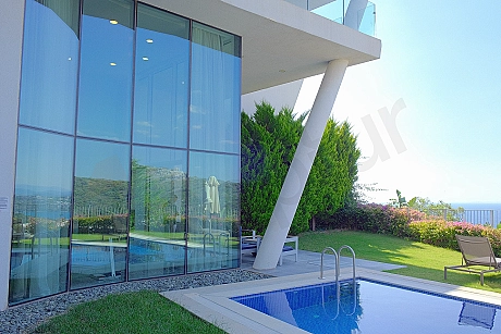 Exterior facade view of a modern 4+1 luxury villa with a seafront location in Bodrum.