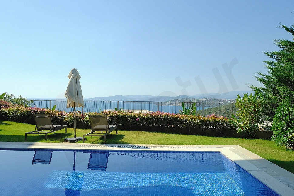 A large outdoor swimming pool with clear blue water and modern design.