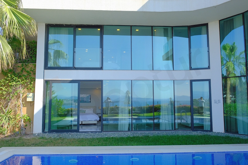 Exterior facade view of a luxury villa with modern architecture in Bodrum, Mugla