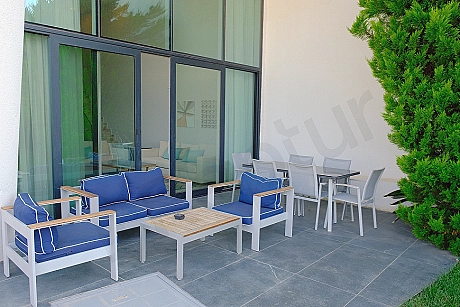 Spacious and sea-view terrace area of the luxury villa in Bodrum, furnished with modern furniture.