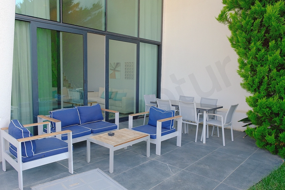 Spacious and sea-view terrace area of the luxury villa in Bodrum, furnished with modern furniture.
