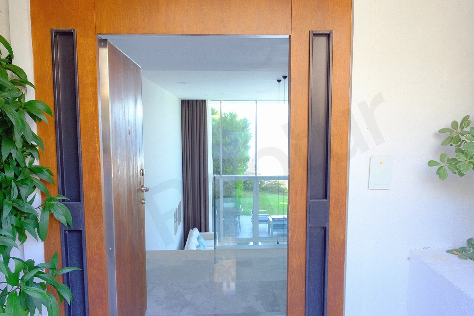 Modern and stylishly designed furnished apartment entrance of a luxury villa for sale in Bodrum.