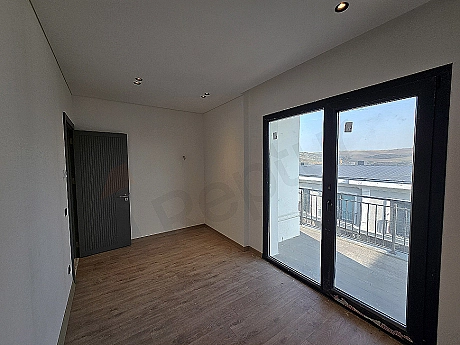 Image of a spacious and bright bedroom.