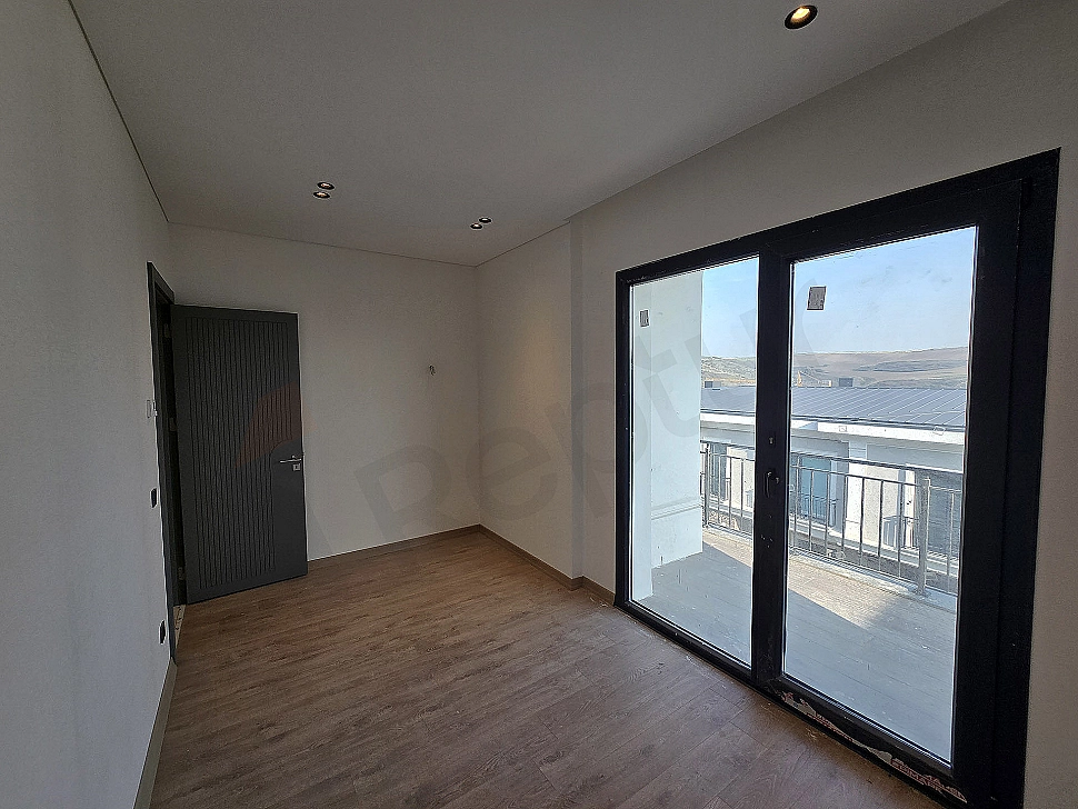 Image of a spacious and bright bedroom.