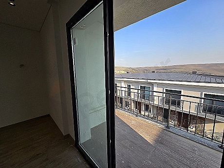 Image of a villa with a spacious balcony.