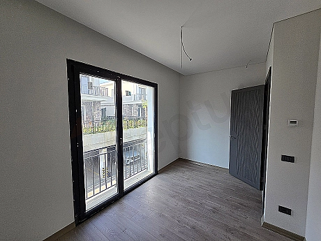 Image of a spacious and bright bedroom.