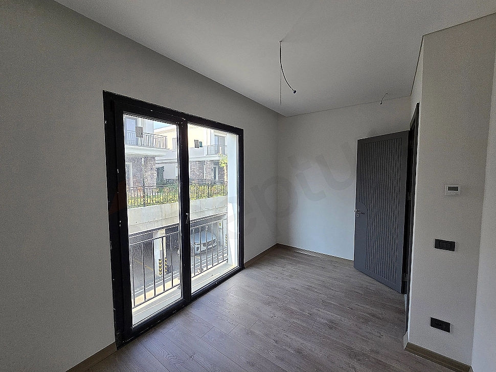 Image of a spacious and bright bedroom.