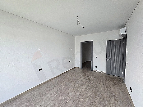 Image of a spacious and bright bedroom.