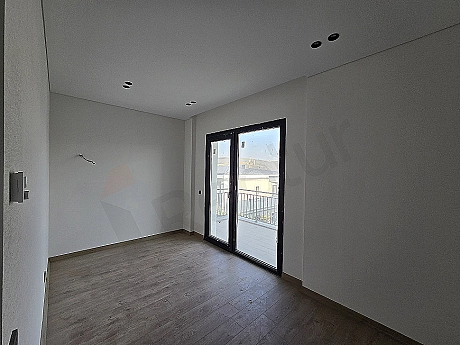 Image of a spacious and bright bedroom.