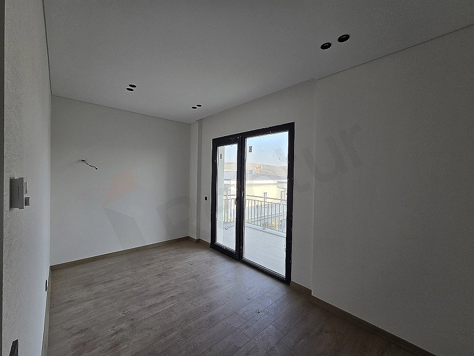 Image of a spacious and bright bedroom.