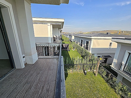 Image of a luxurious villa with a spacious balcony.