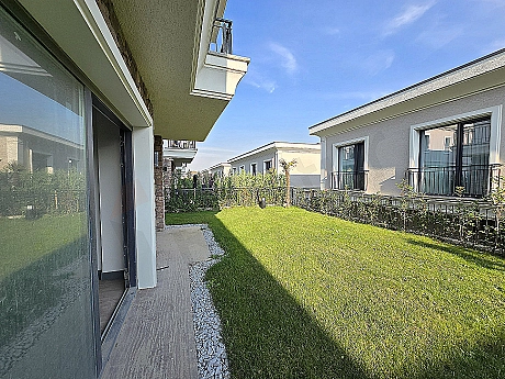 Image of a villa with a spacious garden.