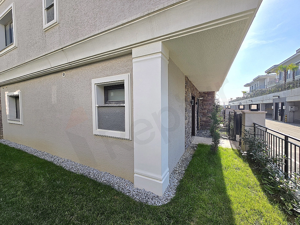 Photo of villa with large garden.