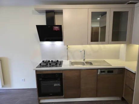 Spacious and modern open kitchen area within a contemporary apartment.