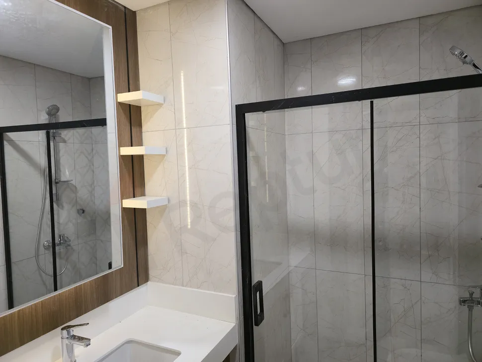 Modern and stylishly designed, clean-looking bathroom area.