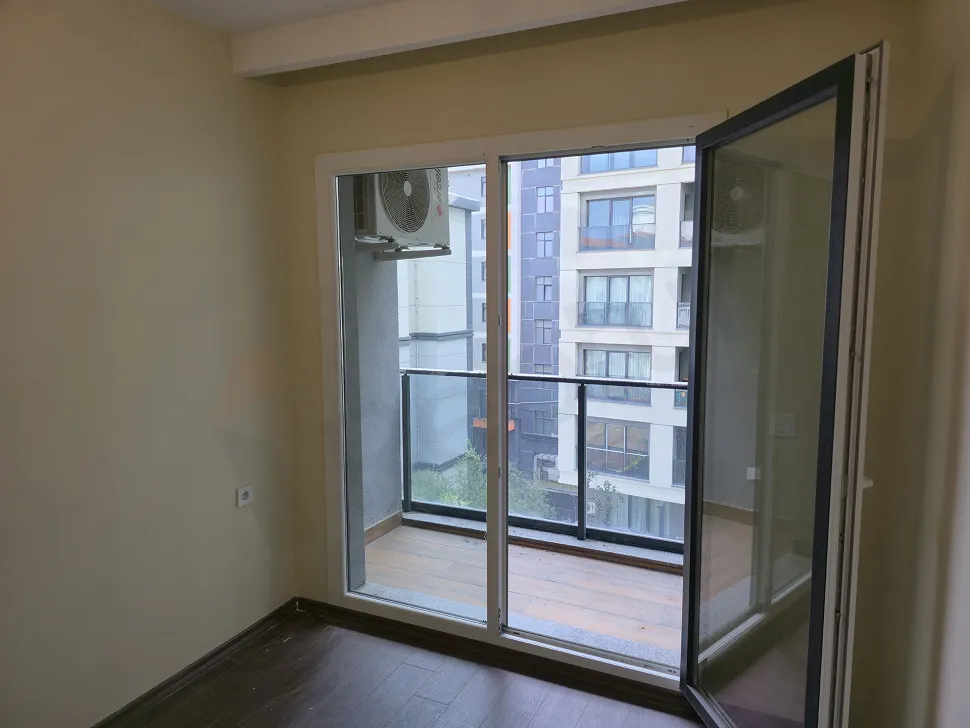 Spacious and modern balcony view of an apartment.
