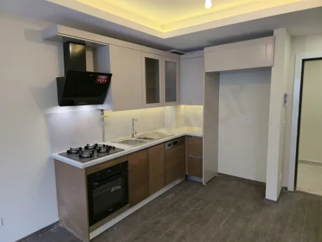 Spacious and functional open-plan kitchen area of a modern apartment.