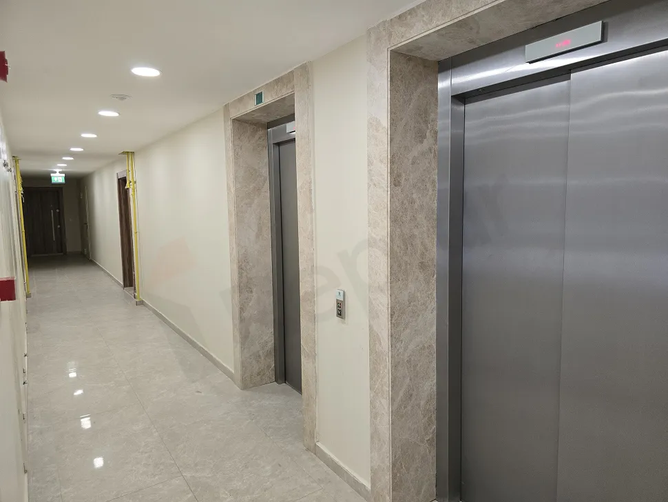 Modern elevator cabin with metallic doors and sleek design