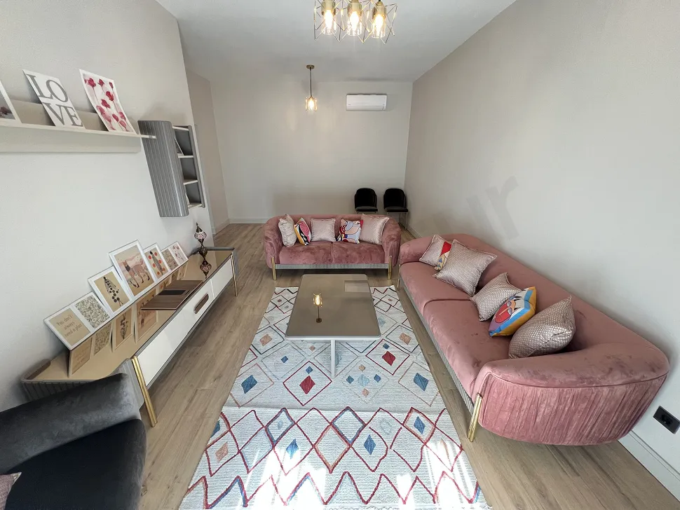 Modern and spacious living room area of a 2+1 apartment for sale in Kartal.