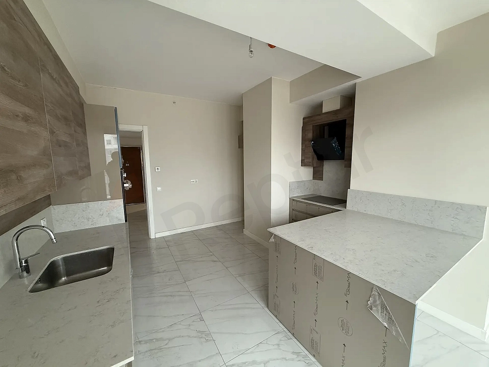 A spacious and modernly designed kitchen area.