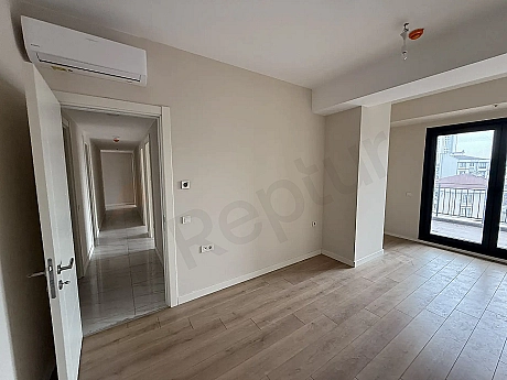 Spacious, bright, and modernly designed bedroom area of the apartment for sale in Cekmekoy, Istanbul.