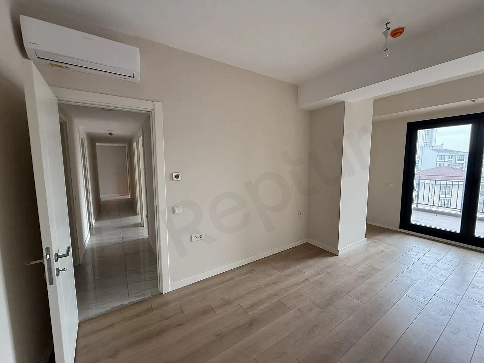 Spacious, bright, and modernly designed bedroom area of the apartment for sale in Cekmekoy, Istanbul.