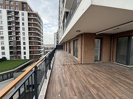 Spacious and open terrace area of a modern apartment with a city view in Cekmekoy, Istanbul.