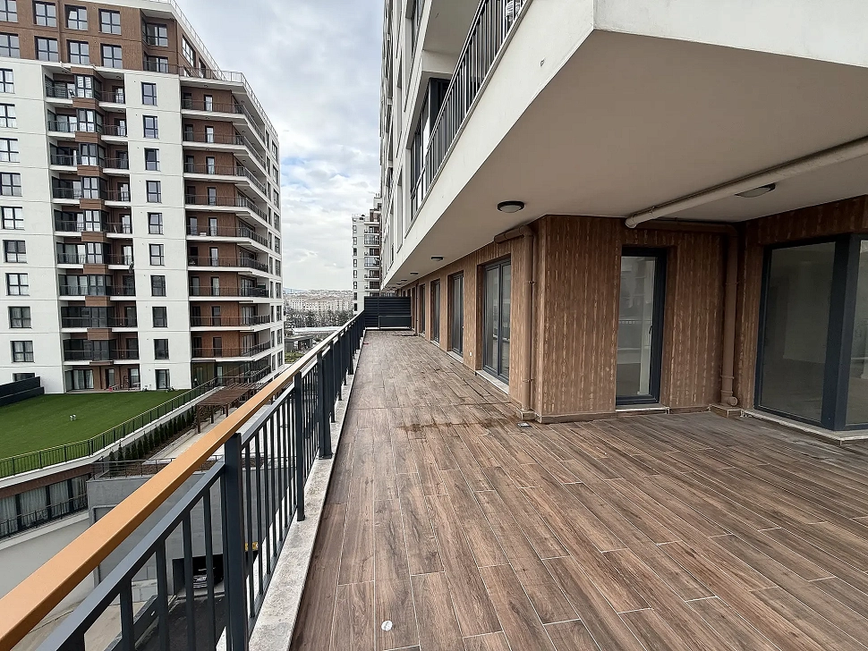 Spacious and open terrace area of a modern apartment with a city view in Cekmekoy, Istanbul.