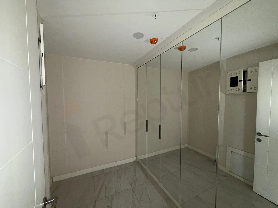 Spacious, clean, and organized storage unit area within a modern residential project.