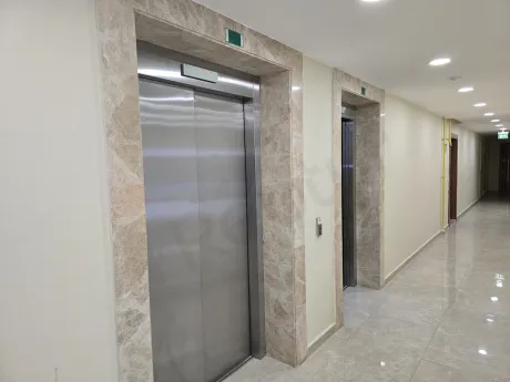 View of a stylish and secure elevator inside a modern building.