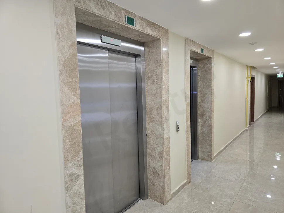 View of a stylish and secure elevator inside a modern building.