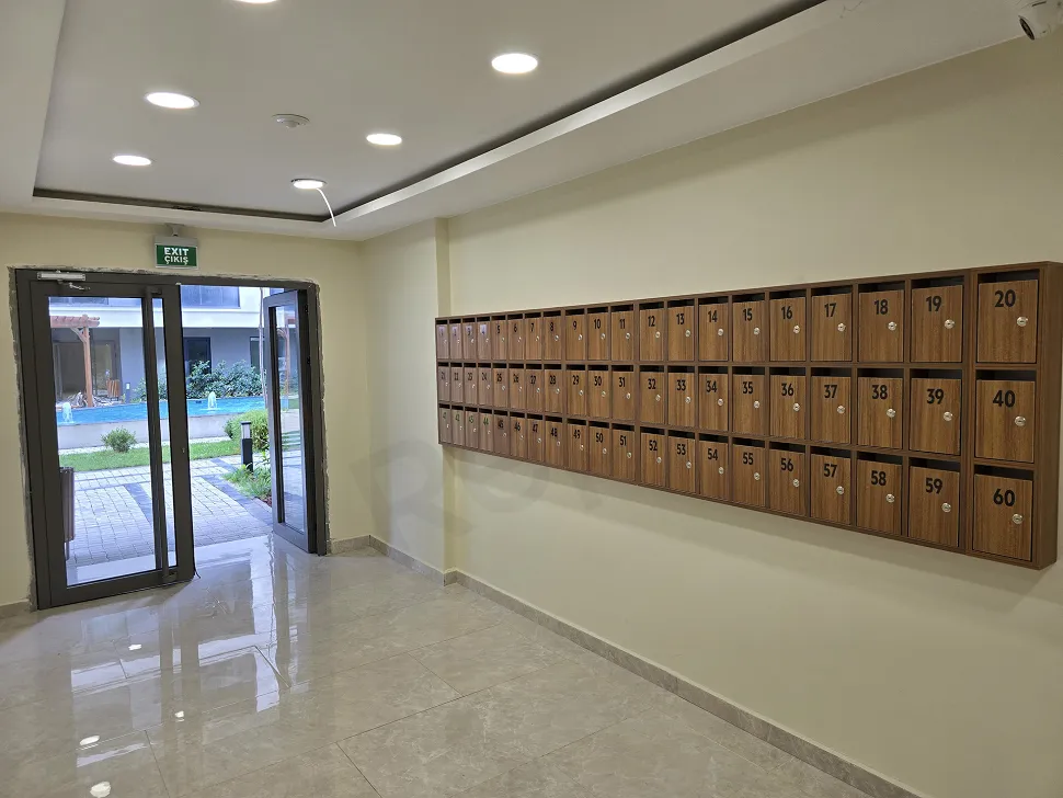 Modern and stylishly designed residence entrance lobby with large windows and luxury lighting.