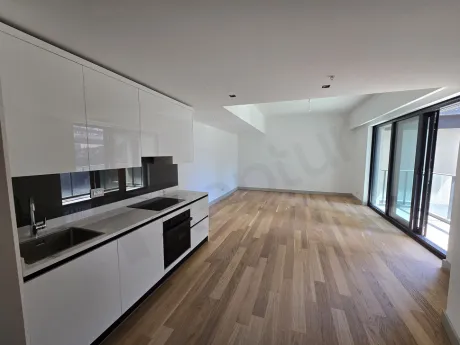 Modern and spacious open-plan kitchen area of a luxury apartment in Sisli.