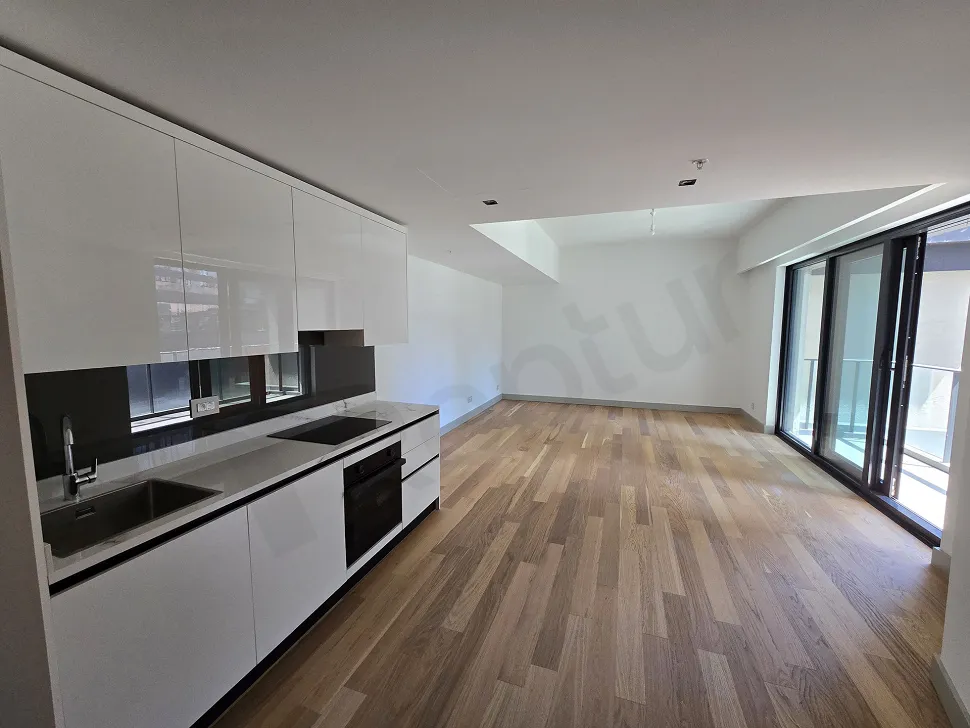 Modern and spacious open-plan kitchen area of a luxury apartment in Sisli.
