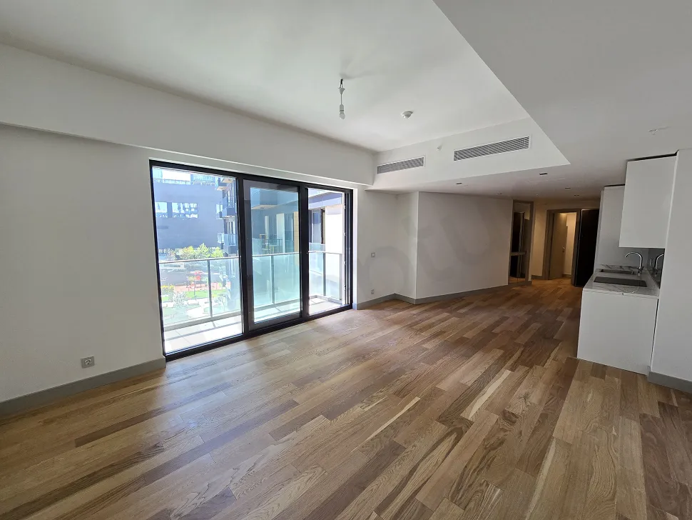 Spacious and modern living room area with large windows in a luxury residence in Sisli.