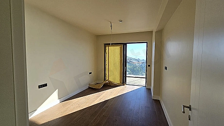 Modern, spacious, and bright bedroom design in a new building in Bodrum.