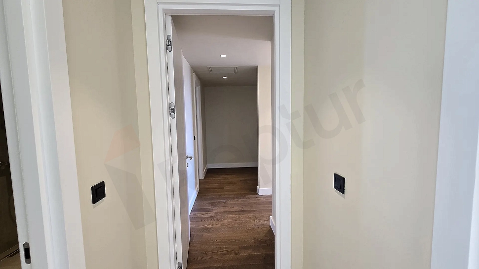 Spacious and bright corridor of a modern residence apartment.