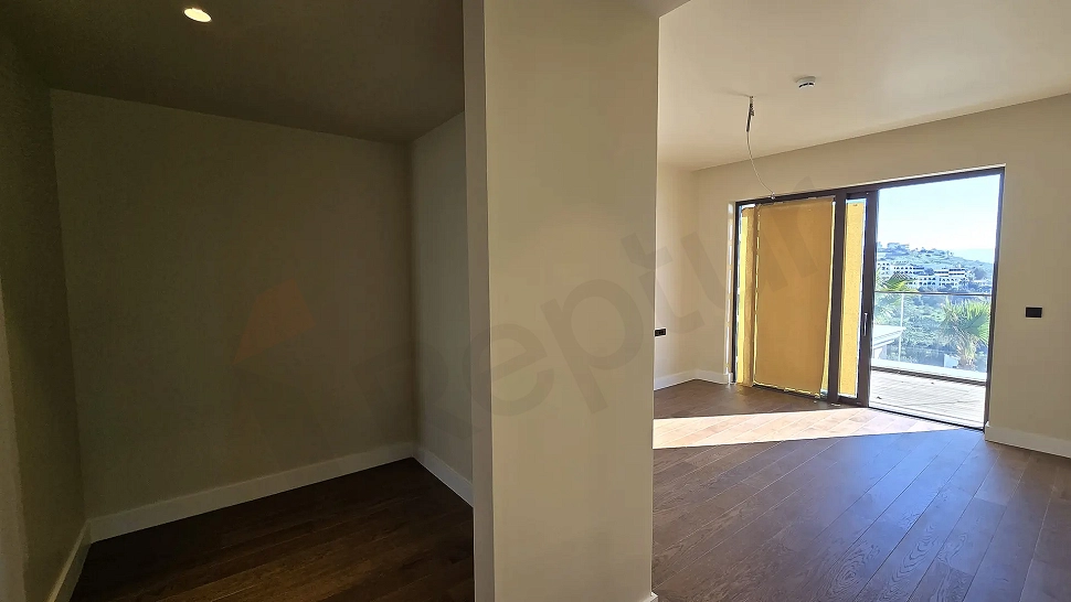 Modern and spacious bedroom area of a residence apartment in Bodrum.