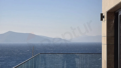 Panoramic view of the deep blue sea, coastline, and horizon from a building in Bodrum.