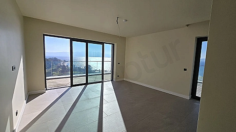 Spacious living room area with a fresh and modern design.