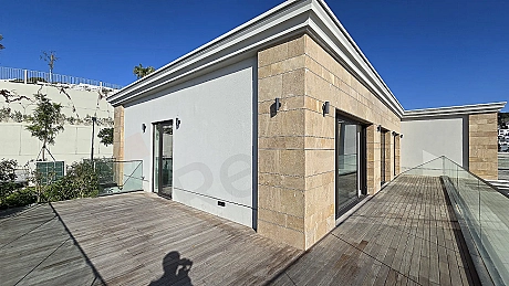 Terrace area of a spacious and modern residence apartment with a sea view.