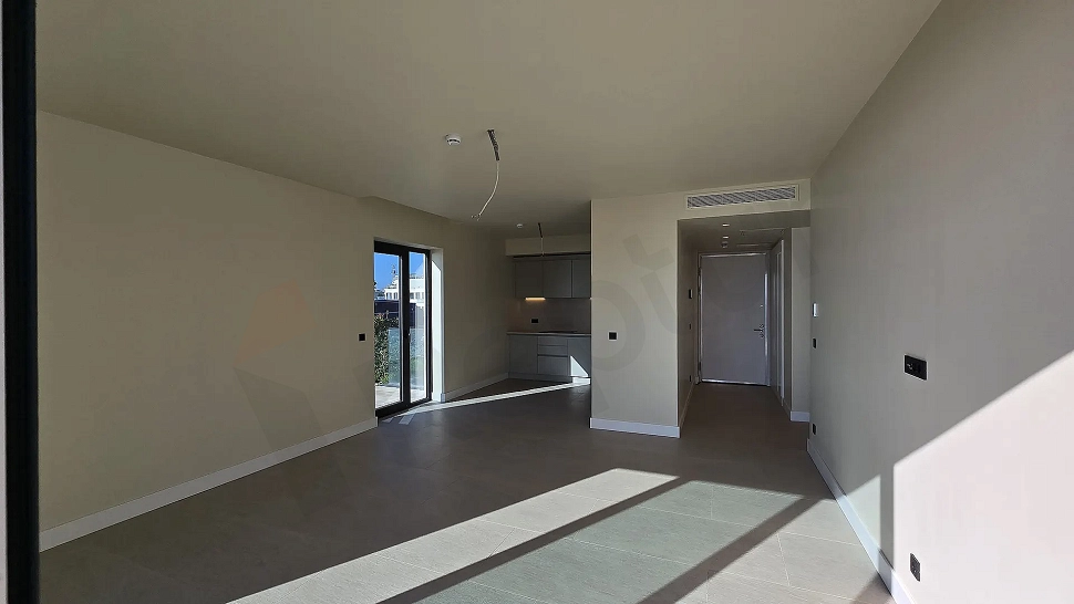 Spacious and bright living room area of a 2+1 seafront apartment in Bodrum.