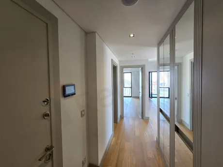 Entrance hallway and main door of a modern residence apartment.