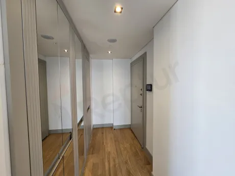Entrance door and hallway area of a modern apartment.