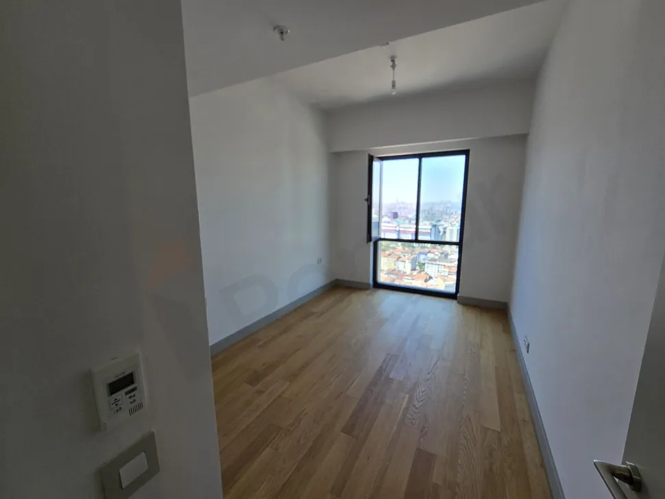 Spacious and bright bedroom area of a modern residence apartment in Sisli, Istanbul.