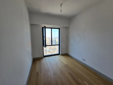 Spacious and bright bedroom area of a luxury 1+1 apartment in a modern residence project in Sisli.